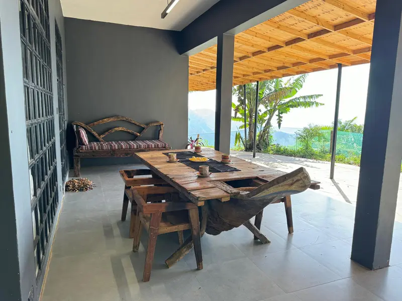 Living room of the main house at Nilo Forest Lodge with handmade dhow-wood furniture
